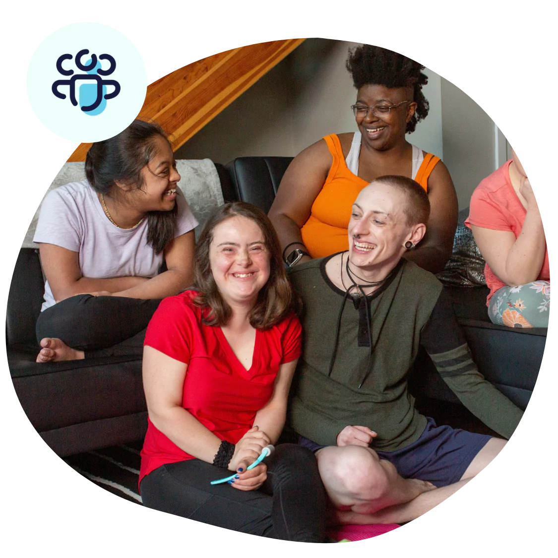 Group of friends smiling while sitting together